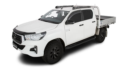 Système de fixation Backbone pour Toyota Hilux, accessoire Rhino-Rack, montrant la fixation robuste sur le toit du véhicule.