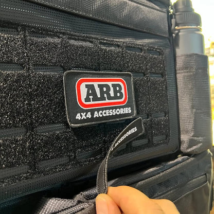 Organisateur de siège ARB4x4, sac de rangement robuste pour véhicule tout-terrain, en tissu durable, avec plusieurs compartiments.