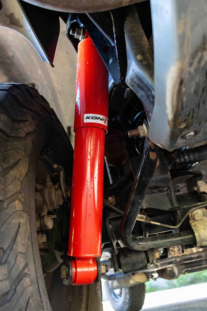 Amortisseur KONI Heavy Track RAID pour INEOS Grenadier, suspension renforcée, rehausse de 0 à 50 mm, robuste et performant.
