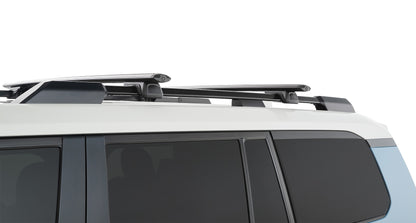Barres de toit Vortex RHINO-RACK pour Land Cruiser Prado 250, fixation robuste pour transport en toute sécurité.