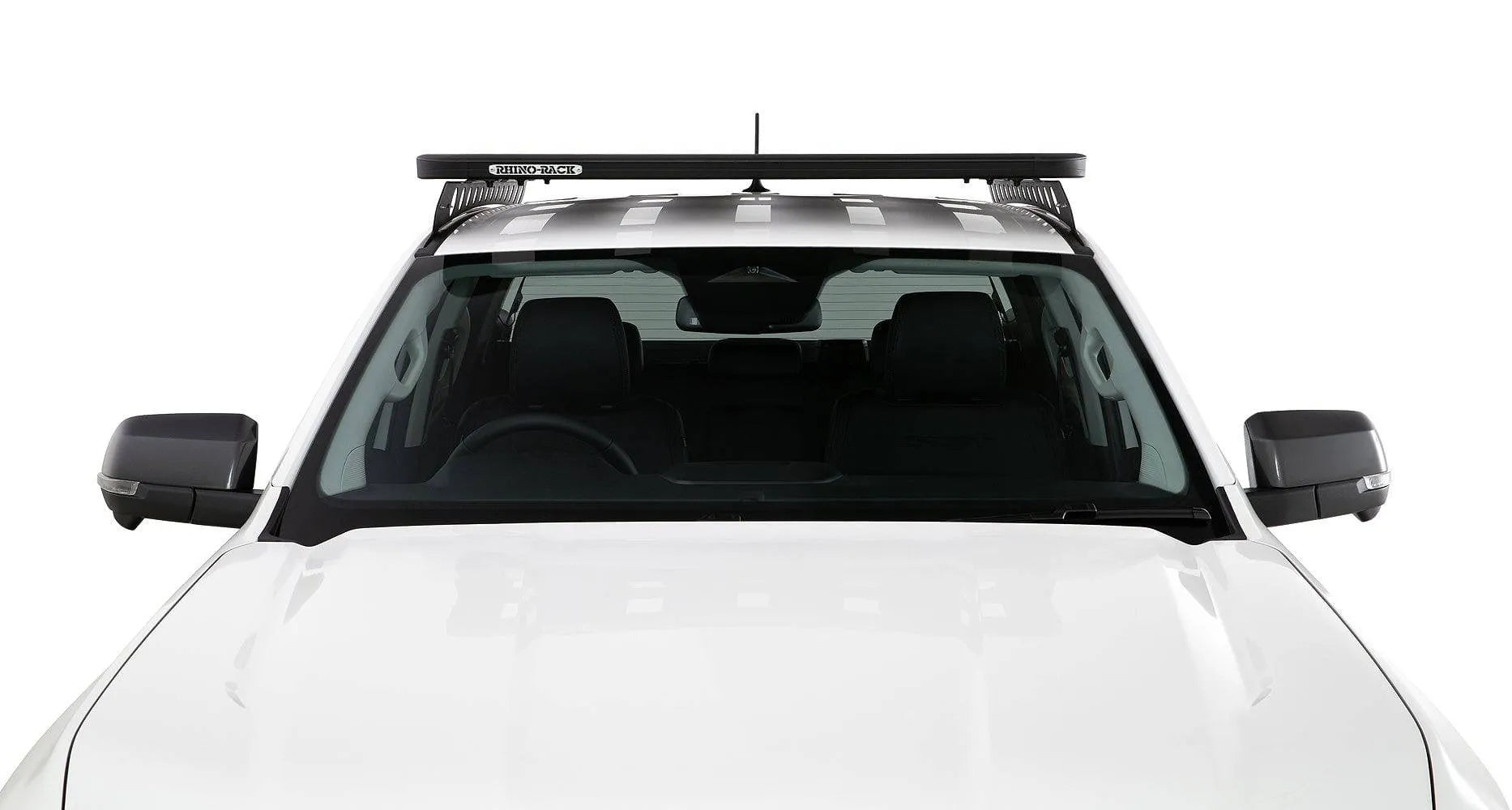 Kit galerie de toit Rhino-Rack Backbone pour Toyota Hilux Revo 2016+ avec barres et fixation visible sur le toit du véhicule.
