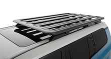Galerie de toit Rhino-Rack pour Land Cruiser Prado 250 avec rails, montage solide pour transporter équipements et charges.