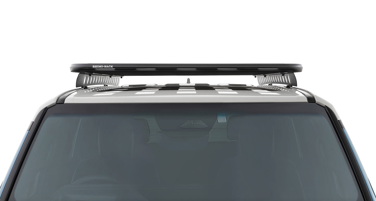 Kit galerie de toit Rhino-Rack Pioneer pour Land Cruiser Prado 250, dimensions 2100x1240mm, avec barres robustes et fixation solide.