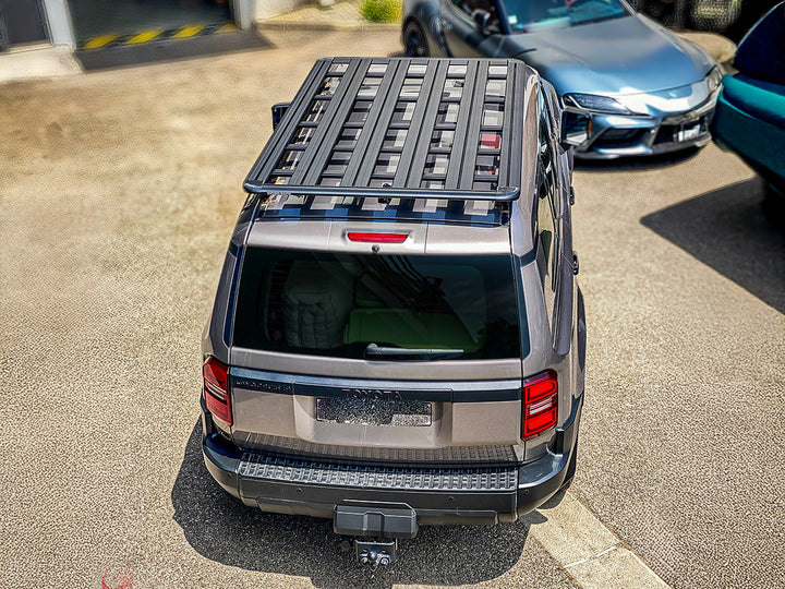Kit galerie de toit Rhino-Rack Pioneer pour Land Cruiser Prado 250, dimensions 2100x1240mm, avec barres et fixations robustes.