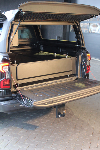 Système double tiroir RUUUD pour Ford Ranger Next Gen 2023+ PHEV, tiroirs robustes et spacieux, installation dans le véhicule.