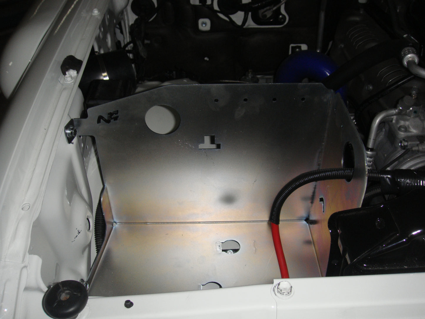 Paired steel battery trays for Toyota HDJ80 by N4-Offroad, durable accessories for off-road vehicle battery storage.