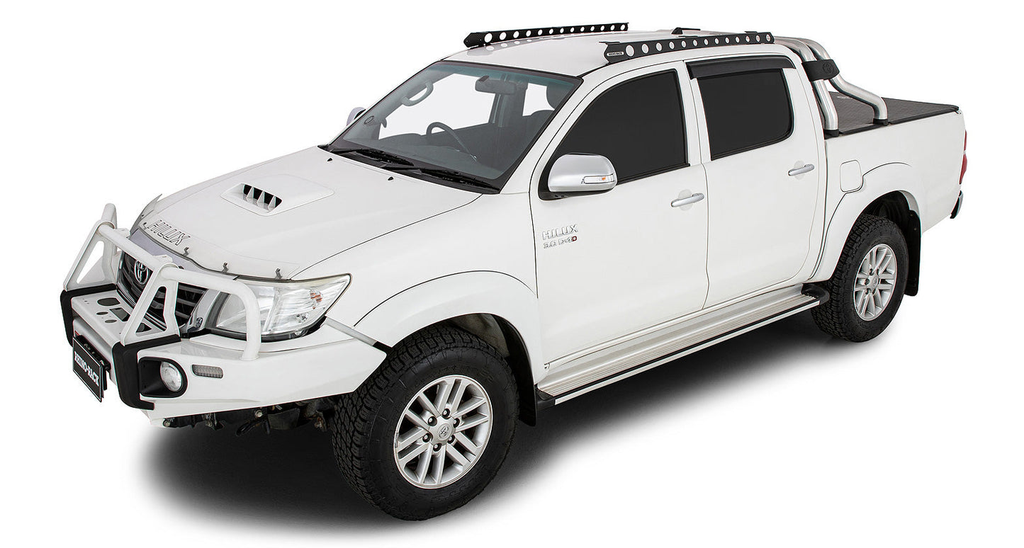 Système de fixation Backbone pour Toyota Hilux, accessoire Rhino-Rack, avec supports robustes pour équipement de toit.
