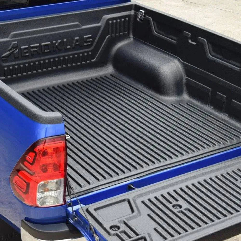 Bac de benne avec rebords pour Toyota Hilux Extra Cab 2016+ de la marque Aeroklas, robuste et pratique pour le chargement.