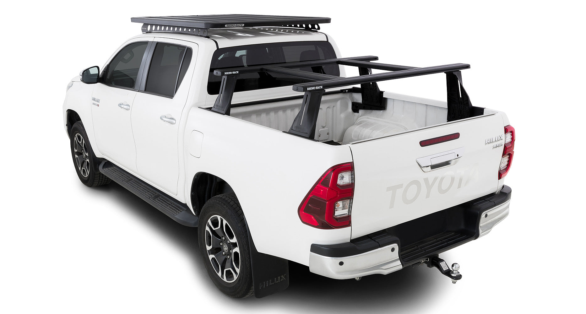 Kit de 2 barres de toit RHINO-RACK pour Toyota Hilux Revo 2015+ avec système Reconn-Deck, longueur 1500 mm, et barres transversales.