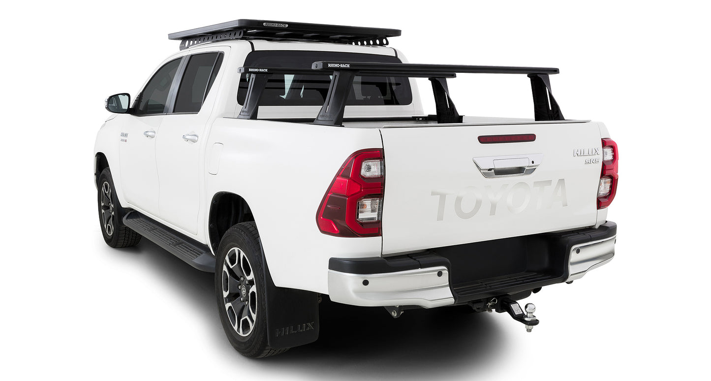 Kit de 2 barres de toit Rhino-Rack Reconn-Deck 1500 mm pour Toyota Hilux Revo 2015+, systèmes de fixation robustes.