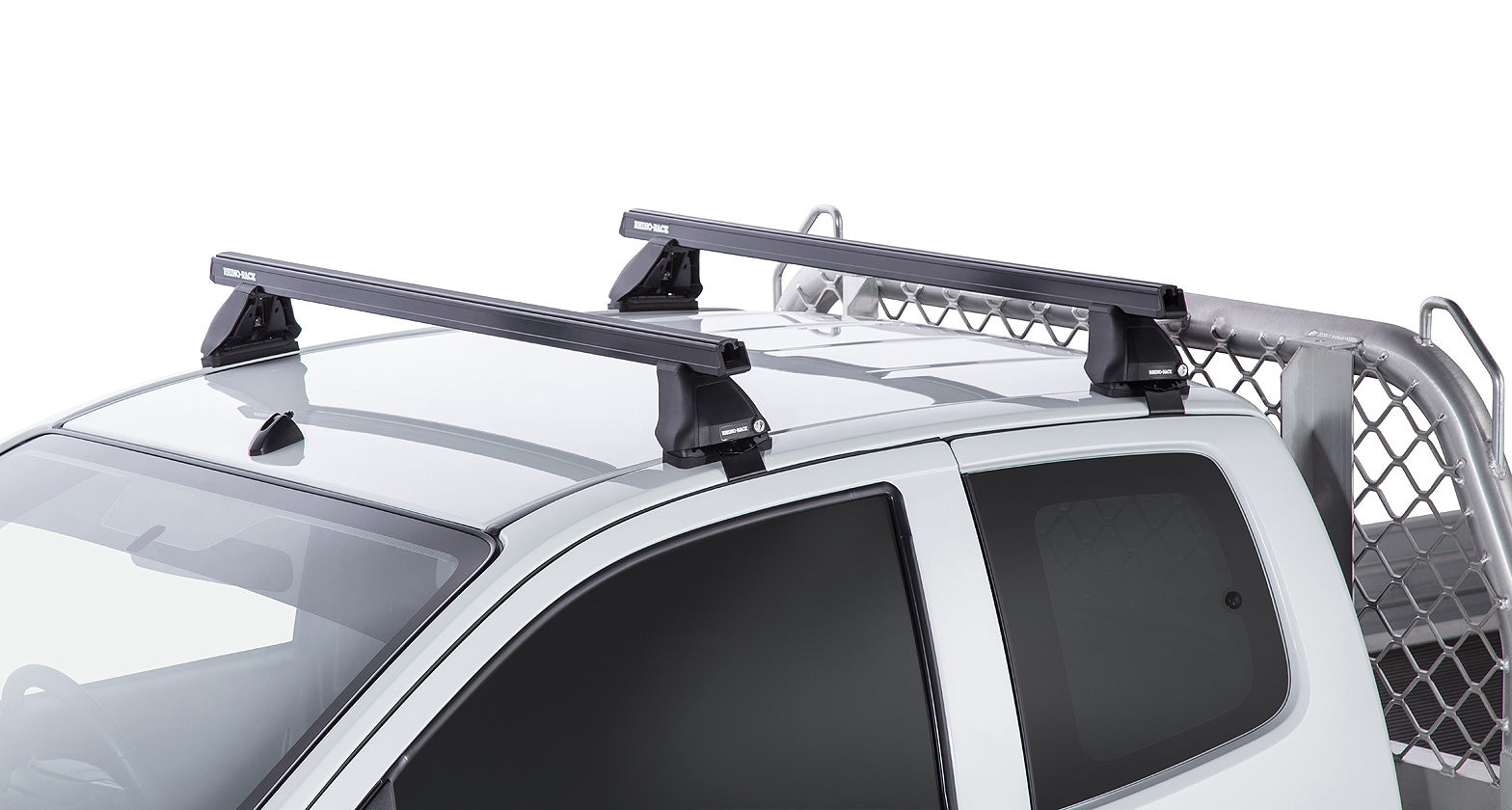 Kit 2 barres de toit Heavy Duty noires de 1375mm pour Isuzu D-Max Gen II TF 2016-2020, marque RHINO-RACK.