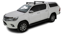 Kit 2 barres de toit noires RHINO-RACK Heavy Duty 1250mm pour Toyota Hilux Revo 2015+, fixations RCH Trackmount, robuste et pratique