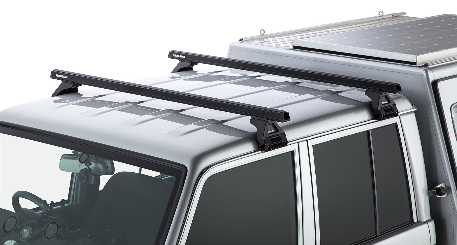 Kit de 2 barres de toit noires RHINO-RACK Heavy Duty 1500mm avec pieds pour Toyota Land Cruiser série 79 2007+