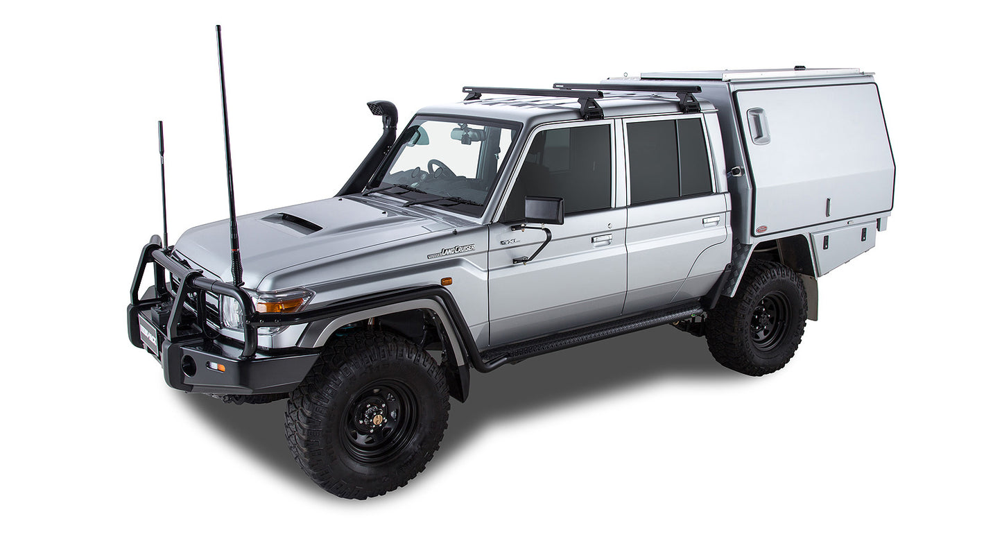 Kit de 2 barres de toit noires Heavy Duty de 1500mm avec pieds pour Toyota Land Cruiser série 79 2007+ de RHINO-RACK.