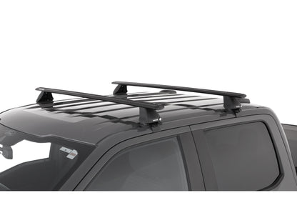 Kit de 2 barres de toit RHINO-RACK Sportz 1500mm pour Ford F150 Super Cab 2015+, visibles sur le véhicule.