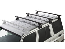 Kit de 3 barres de toit Sportz de 1500mm pour Toyota Land Cruiser HZJ76 GRJ76, marque Rhino-Rack, fixation robuste.