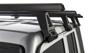 Kit de 4 barres de toit noires Heavy Duty 1500mm avec pieds pour Toyota Land Cruiser série 76 2007+ de la marque RHINO-RACK.