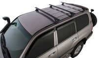 Kit de 3 barres de toit VORTEX pour Land Cruiser 100 1998-2007, marque RHINO-RACK, avec fixation solide et design robuste.